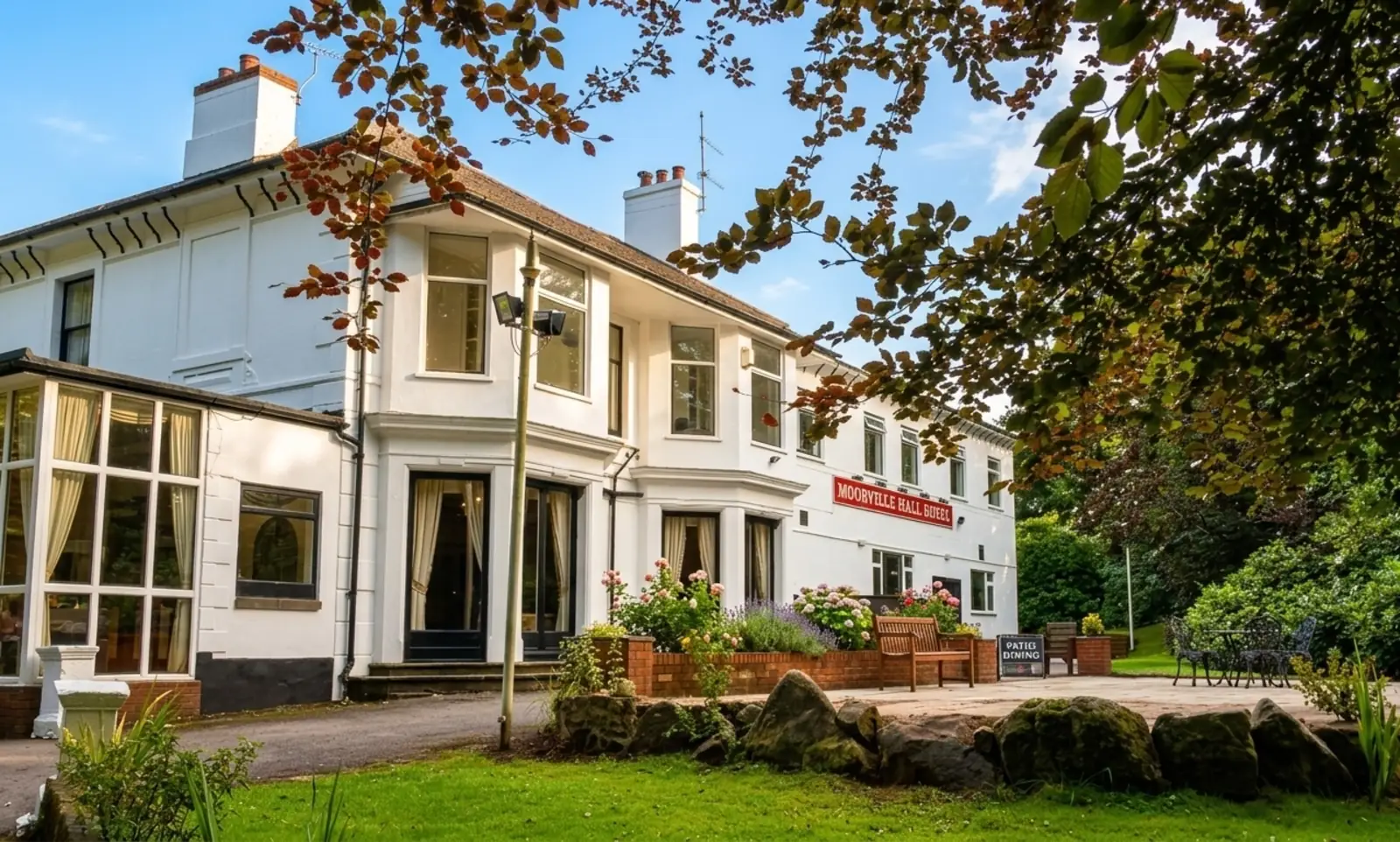 Moorville Hall Hotel exterior with garden and patio in Stoke-on-Trent